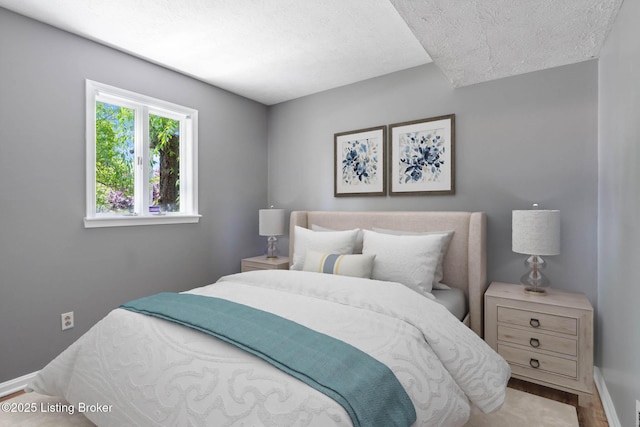 10207 El Coco Ct, Louisville, KY 40291 - bedroom featuring a textured ceiling and wood finished floors
