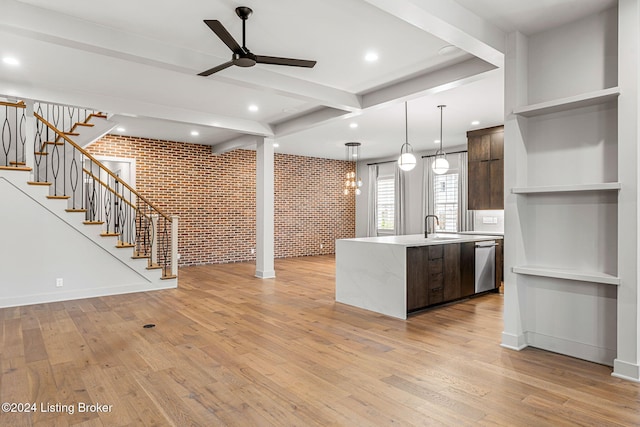 kitchen with brick wall, light countertops, dark brown cabinets, dishwasher, and modern cabinets