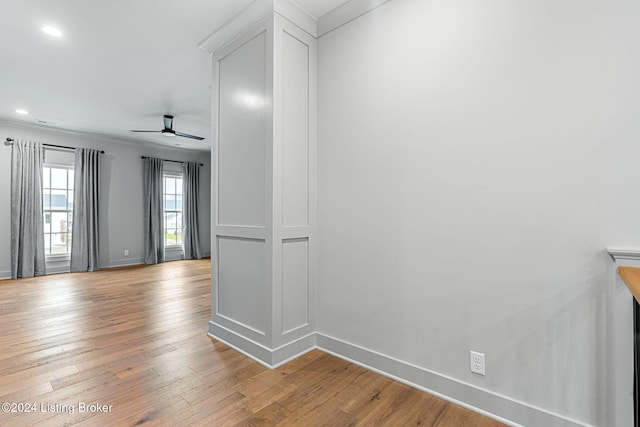 unfurnished room featuring crown molding, recessed lighting, light wood-style floors, a ceiling fan, and baseboards