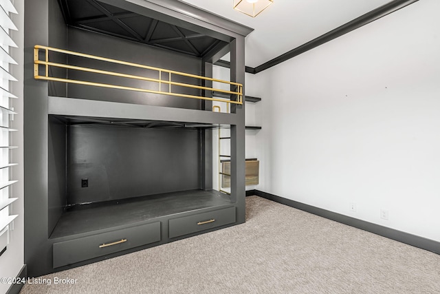 room details featuring carpet floors, crown molding, and baseboards