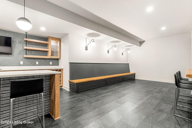 bar featuring pendant lighting, recessed lighting, and baseboards