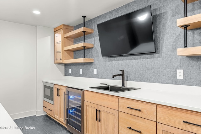 kitchen with beverage cooler, a sink, light countertops, built in microwave, and open shelves