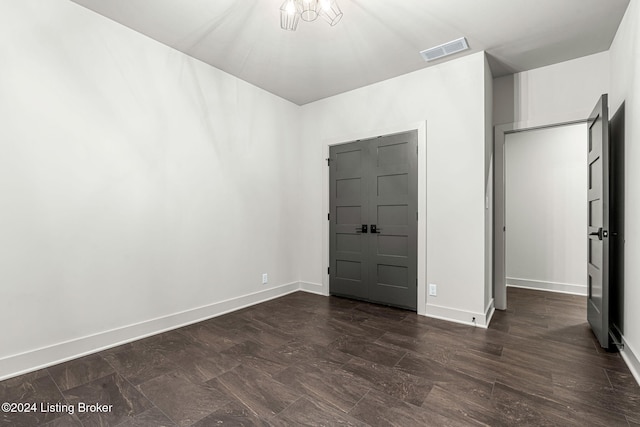 unfurnished bedroom with visible vents and baseboards