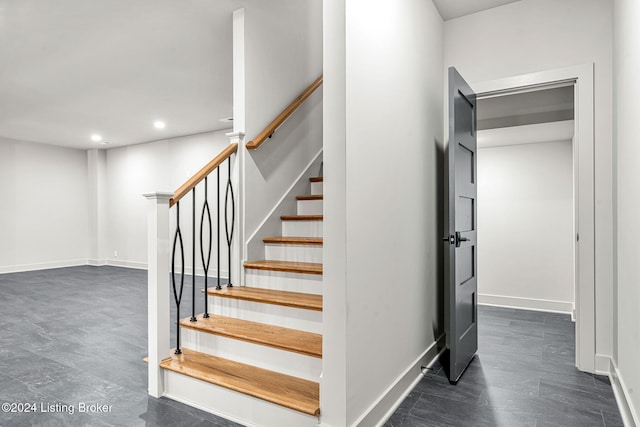 staircase featuring recessed lighting and baseboards