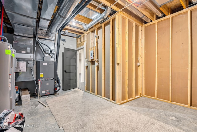 unfinished basement featuring electric water heater