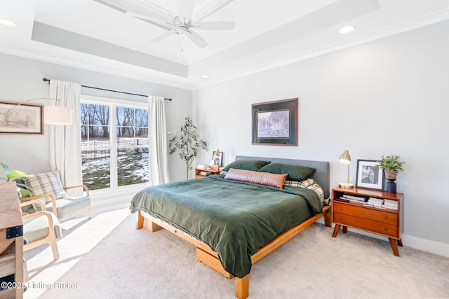 carpeted bedroom featuring ornamental molding, recessed lighting, a raised ceiling, and baseboards