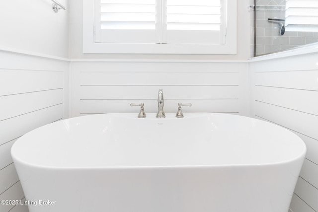 full bath with a freestanding bath