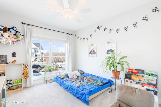 carpeted bedroom with a ceiling fan