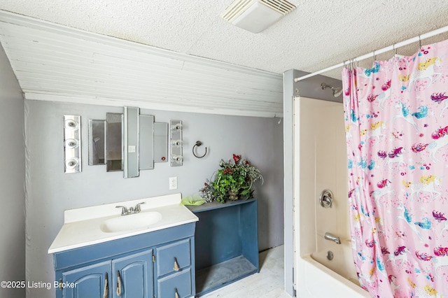 bathroom with a textured ceiling, visible vents, shower / bath combination with curtain, and vanity