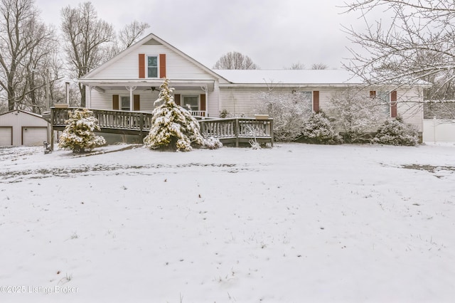 view of front of house featuring a garage and an outdoor structure