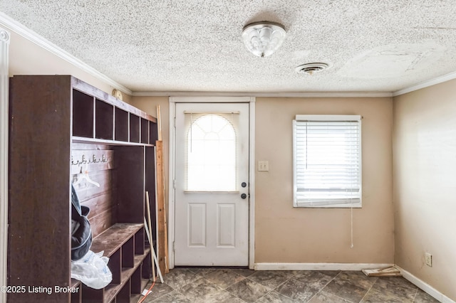 mudroom with visible vents, a healthy amount of sunlight, a textured ceiling, and baseboards