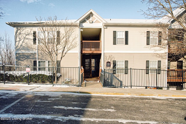 view of building exterior featuring fence