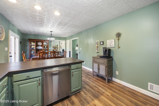 kitchen with dark wood-style flooring, dark countertops, green cabinets, dishwasher, and baseboards