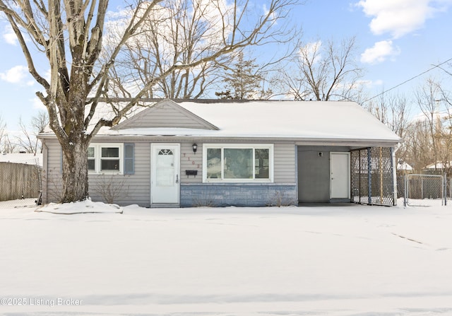 single story home with fence