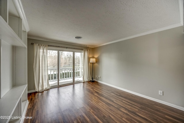 unfurnished room featuring baseboards, visible vents, dark wood-style flooring, and ornamental molding