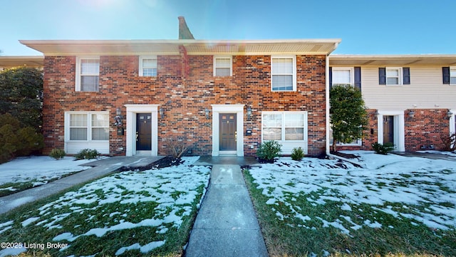 view of property with brick siding