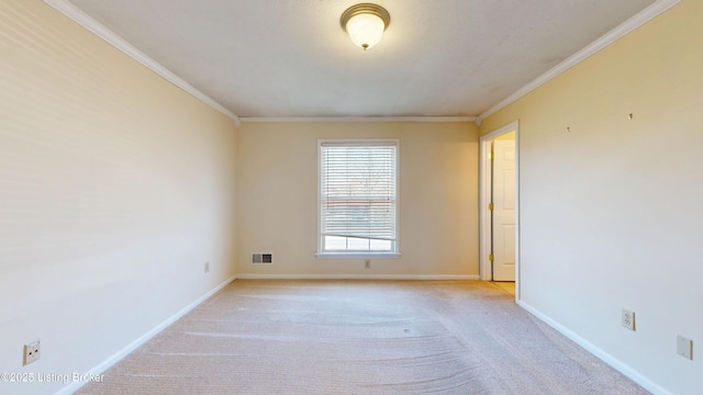 unfurnished room with crown molding, baseboards, visible vents, and light carpet