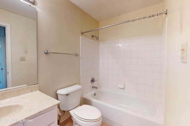 bathroom featuring toilet, vanity, and shower / bathing tub combination