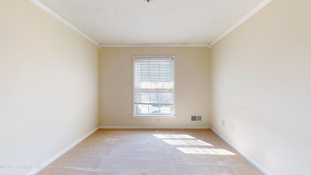 unfurnished room featuring visible vents, baseboards, light colored carpet, and ornamental molding