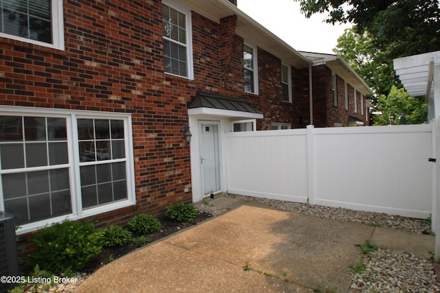 1342 Herr Ln, Louisville, KY 40222 - property entrance featuring brick siding and a patio area