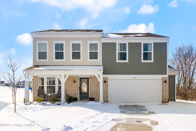 view of front of home with brick siding and an attached garage