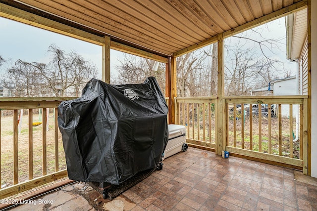 sunroom / solarium with wooden ceiling