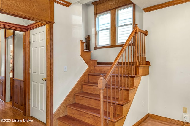 stairway with wood finished floors