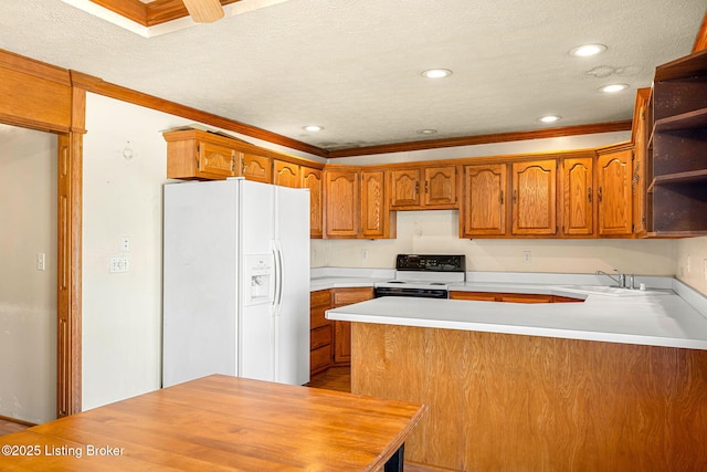 kitchen with a peninsula, white appliances, a sink, open shelves, and brown cabinetry