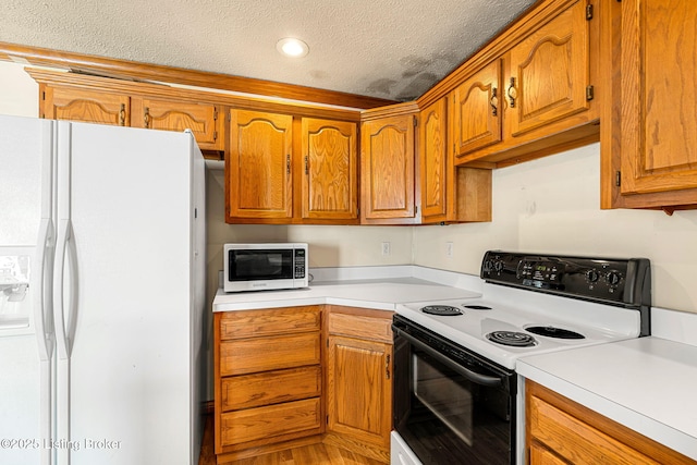 kitchen featuring electric stove, white refrigerator with ice dispenser, light countertops, and brown cabinetry