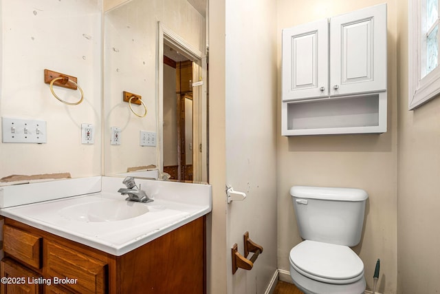 bathroom with toilet and vanity