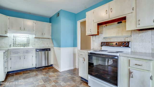 kitchen with visible vents, light countertops, stainless steel dishwasher, white range with electric stovetop, and stone finish floor