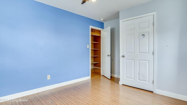 unfurnished bedroom featuring baseboards and light wood-style floors