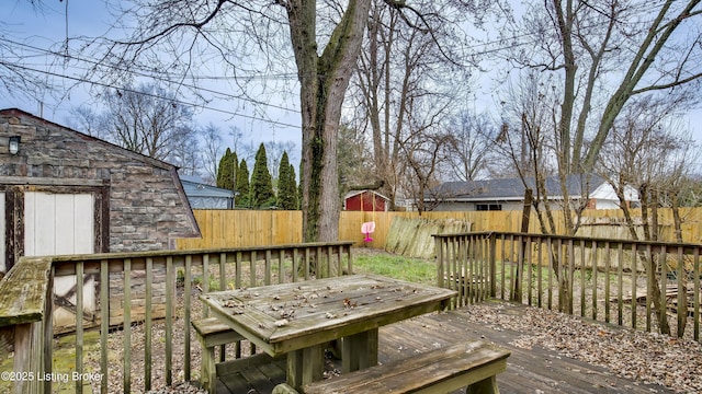 deck with a fenced backyard