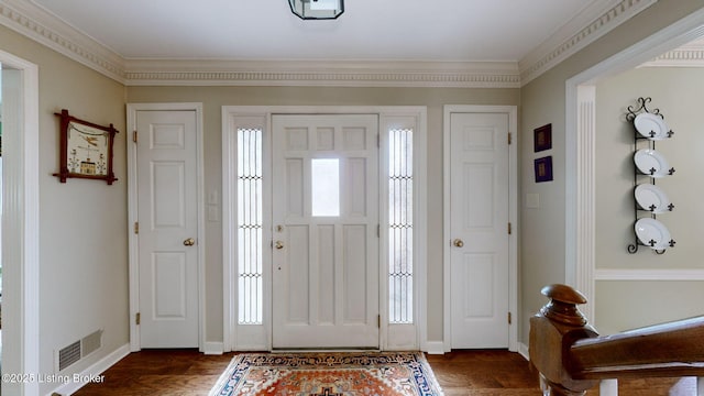 entrance foyer with plenty of natural light, visible vents, dark wood finished floors, and baseboards