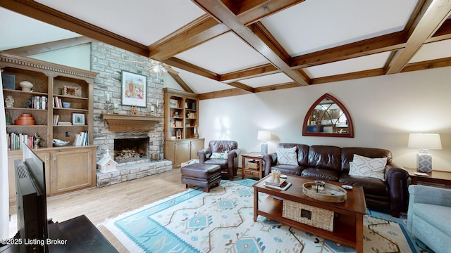 living room with lofted ceiling with beams, coffered ceiling, a fireplace, and wood finished floors