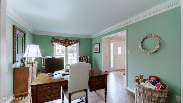 office space with baseboards, wood finished floors, and crown molding