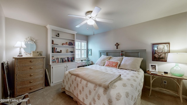 bedroom with light carpet and ceiling fan