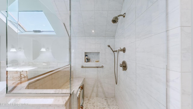 bathroom with tiled shower