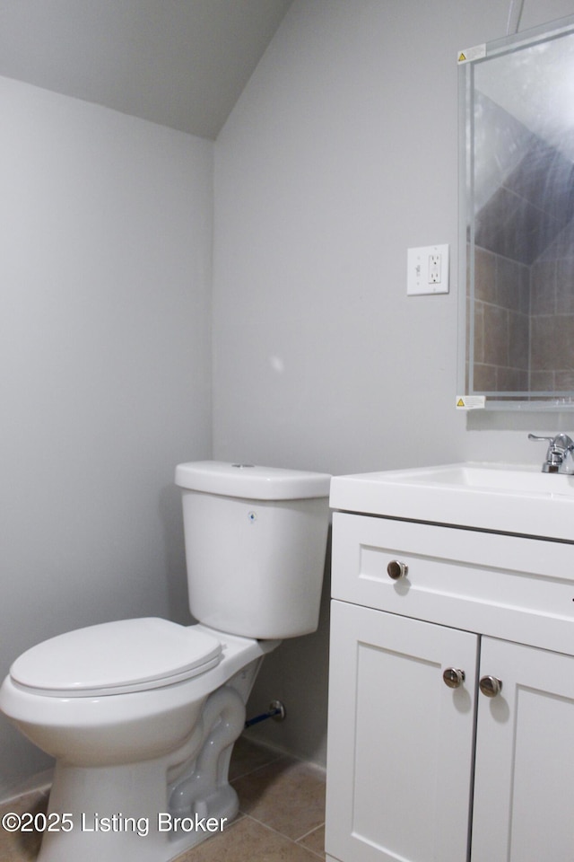 full bath featuring tile patterned flooring, vanity, and toilet