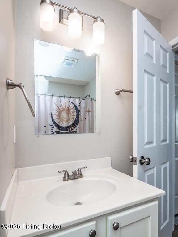 full bathroom featuring vanity