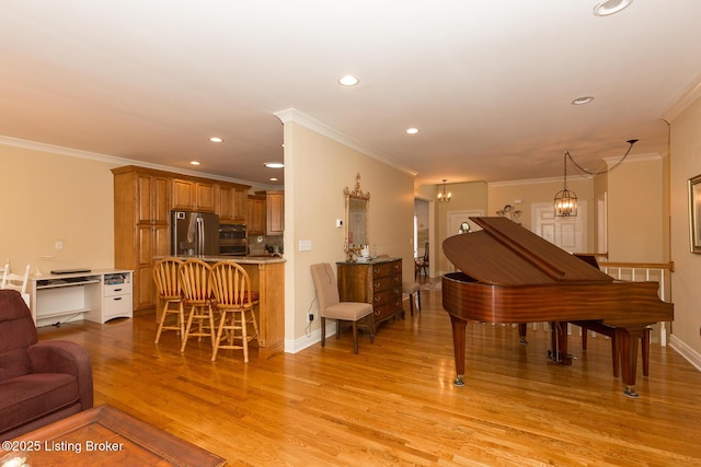 living area with baseboards, recessed lighting, crown molding, a notable chandelier, and light wood-type flooring