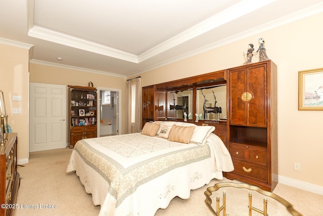 bedroom with light colored carpet, a raised ceiling, baseboards, and ornamental molding