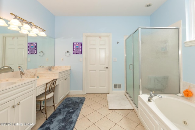 full bathroom with double vanity, visible vents, a shower stall, and tile patterned flooring