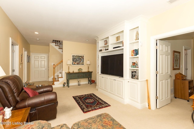 living area with stairway, recessed lighting, and light carpet