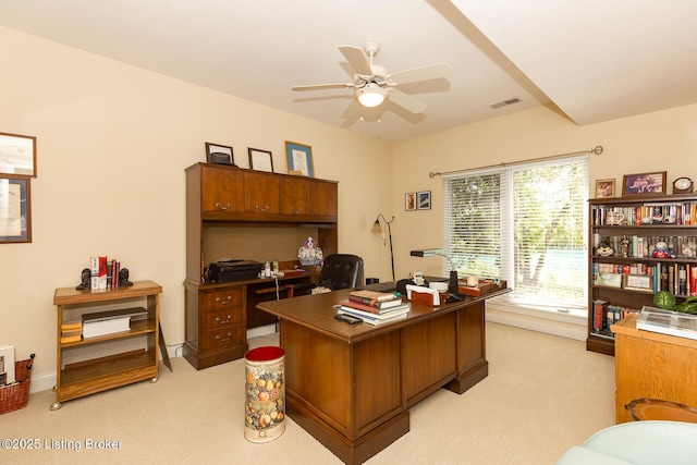 office space with light carpet, visible vents, baseboards, and a ceiling fan