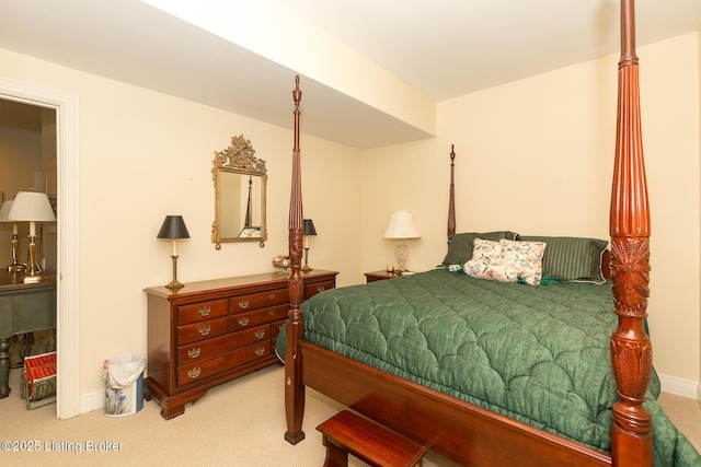 carpeted bedroom featuring baseboards