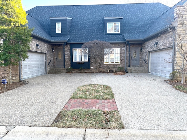 view of front of home with a garage, brick siding, roof with shingles, and driveway