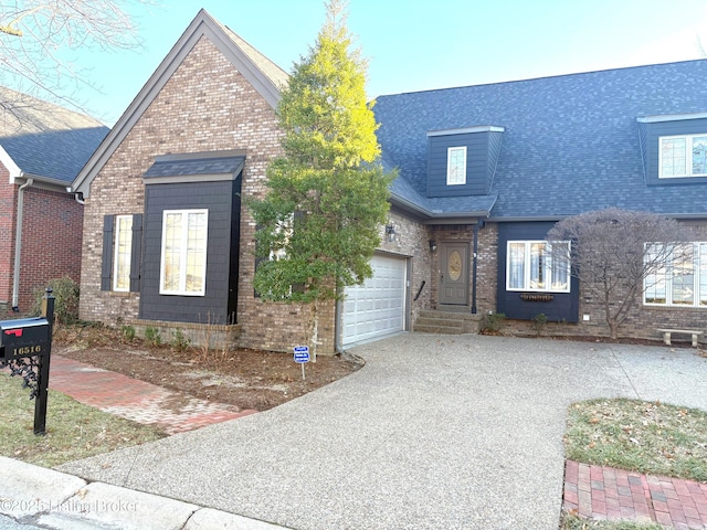 view of front of house featuring brick siding, driveway, a shingled roof, and a garage