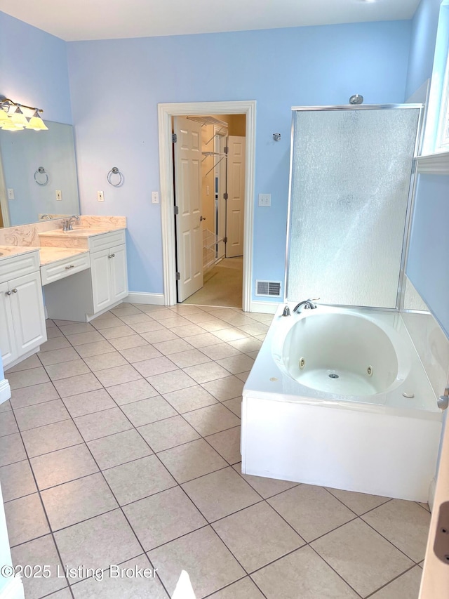 bathroom featuring tile patterned flooring, visible vents, a shower stall, a jetted tub, and vanity