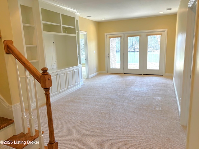 interior space with recessed lighting, visible vents, built in features, and carpet floors